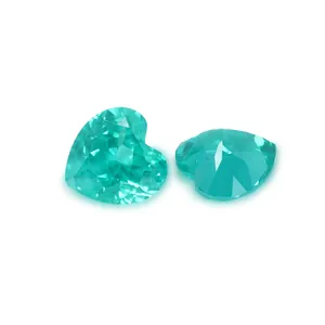 Heart-shaped Paraiba color lab-grown gemstone with inclusions for jewelry making