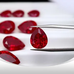 High-quality pear-shaped lab-grown pigeon blood ruby with natural cotton-like inclusions