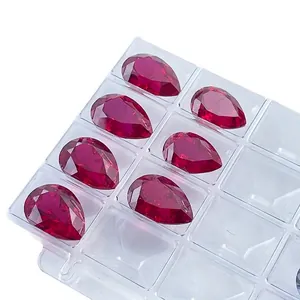 High quality pear cut lab-grown red rubies for jewelry making in a clear display tray.