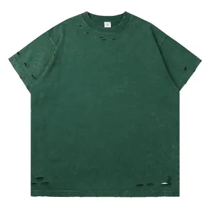 Oversized washed green heavy cotton T-shirt featuring distressed ripped holes details
