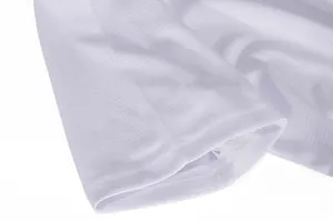 Close-up of breathable white quick-dry fabric showing fine texture and sleeve stitching