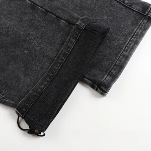 Close-up detail of the adjustable drawstring cuff on men's washed grey fleece sweatpants.