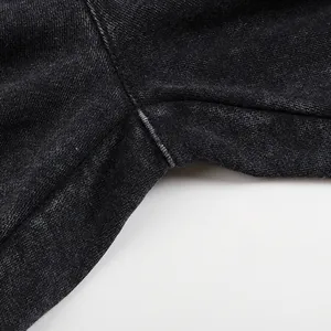 Macro view of high-quality stitching and washed texture on men's distressed sweatpants
