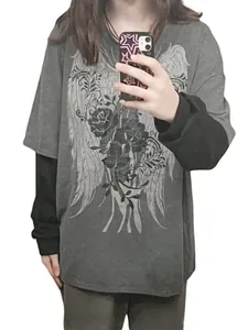 Woman in oversized grey fake two-piece long-sleeve T-shirt with gothic wings print