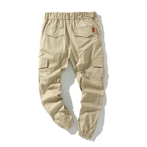 Back view of premium khaki multi-pocket cargo pants with elastic cuffs and waistband