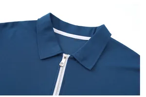 Close-up detail of blue pique Polo shirt with metal zipper and classic collar