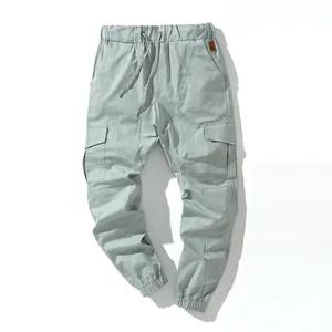 Detail view of men's cotton cargo joggers featuring multiple pockets and drawstring waist
