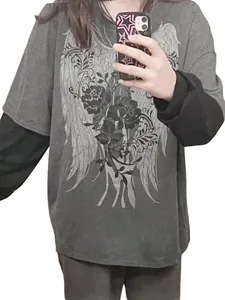 Detailed view of women's oversized fake two-piece long sleeve t-shirt with wing print