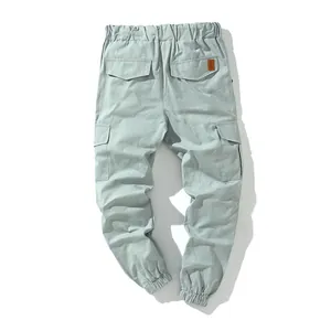 Back view of premium men's mint green cotton cargo jogger pants with multiple pockets