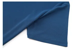 Close-up of breathable piqué polo shirt sleeve hem and side vent stitching detail