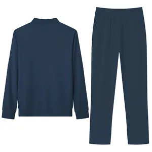 Back view of a navy blue men's casual set showing jacquard grid fabric texture.
