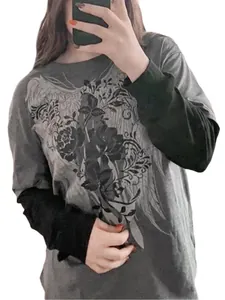 Mirror selfie showing the front details of oversized fake two-piece tee for women.