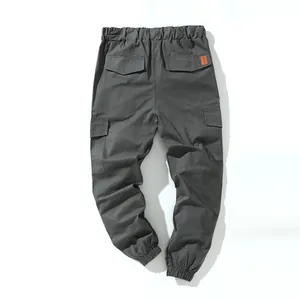 Back view of men's dark grey cotton jogger cargo pants with multiple pockets