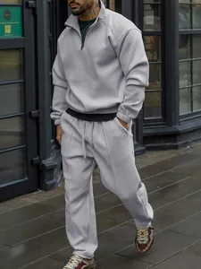 Detail view of men's ribbed tracksuit set showing fit and texture in urban setting