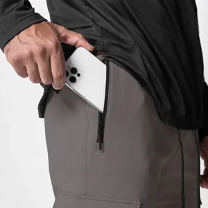 Detail of men's athletic jogger pants showing deep side zipper pocket functionality