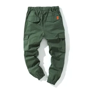Detailed back view of men's dark green multi-pocket cotton cargo joggers trousers