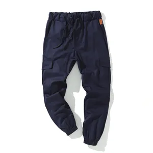 Men's navy blue cotton cargo jogger pants with multiple pockets and drawstring waist