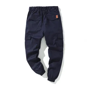 Back view of navy blue cotton cargo jogger pants featuring multi-pockets and elastic cuffs