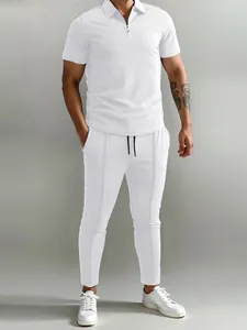 Detailed view of white polo shirt and matching casual pants set for men.