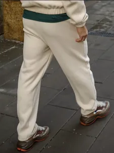 Warm men's cream ribbed tracksuit set featuring long pants and sweatshirt for winter