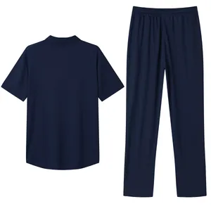 Back view of navy blue men's short-sleeved Polo shirt and matching long pants leisure set