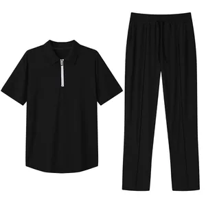 Detail view of the black men's casual two-piece set with polo shirt and long pants