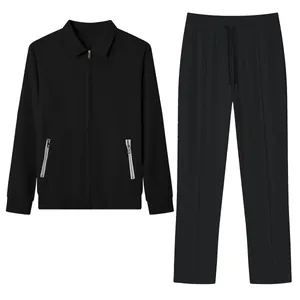 Detail view of men's black jacquard grid casual 2-piece set with zip jacket and pants