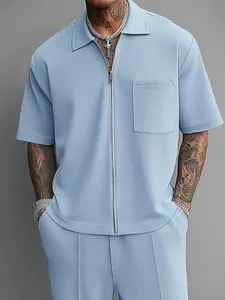 Light blue men's 2-piece set with short sleeve zip polo shirt and casual trousers