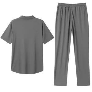 Detail of men's grey pique polo shirt and long pants casual two-piece lounge set