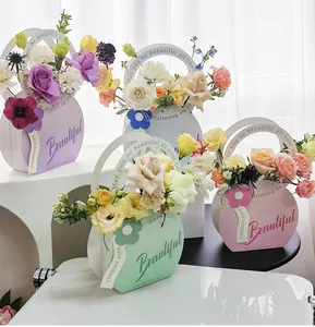 Cajas de regalo redondas portátiles en colores pastel con tipografía decorativa