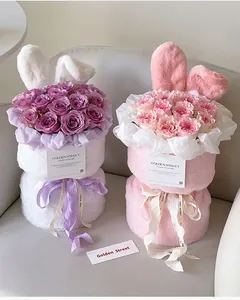 Close-up of plush rabbit ear flower bouquet packaging with soft velvet texture and ribbons