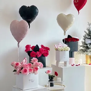 Elegant white square Valentine's Day flower gift boxes with fresh roses and silk bows