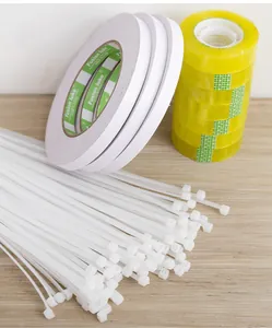 Collection of white nylon zip ties, double-sided tape, and clear yellow floral tapes