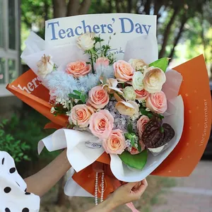 Papier d'emballage floral décoratif orange et blanc pour la Fête des Professeurs