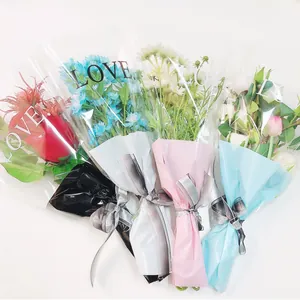 Detail view of four flower bouquet wrapping sleeves with LOVE print.