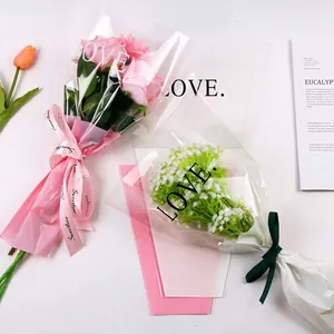 Transparent floral bouquet packaging bags with LOVE print and decorative Sweetlove ribbons