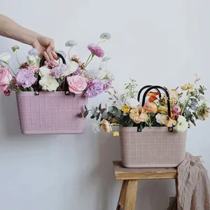 Waterproof plastic handheld flower basket with elegant mesh texture for floral gift