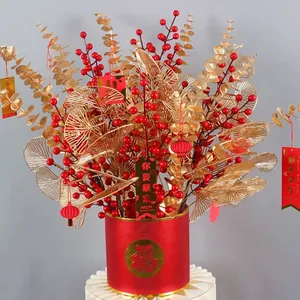Elegant festive artificial golden leaf and fan arrangement for Lunar New Year decoration