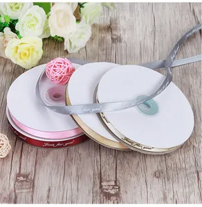 Detail view of colorful satin ribbons with Just for You print for gift wrapping