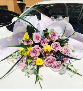 Detail of waterproof purple floral wrapping paper with white daisy pattern for bouquets
