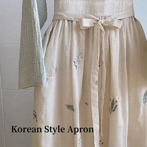 Floral cotton linen apron in vintage French style featuring waist tie and embroidery detail