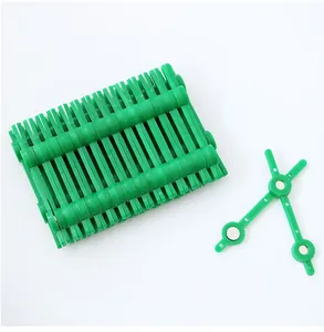 Close-up view of green plastic magnetic corsage clips for wedding floral arrangements