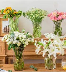 Transparent acrylic flower buckets for floral arrangements in home or flower shop.