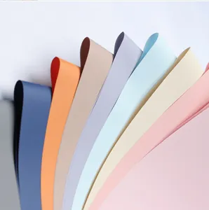 Close-up of colorful waterproof floral wrapping paper arranged in an elegant fan shape