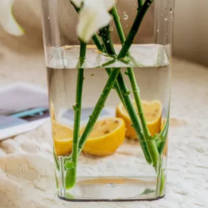 Transparent acrylic flower bucket for fresh floral arrangements with minimalist design