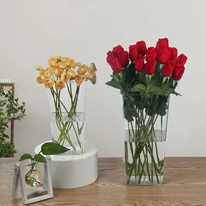 Set of transparent acrylic flower buckets in two sizes with red and yellow roses.