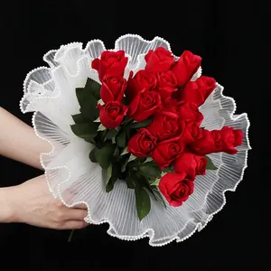 Elegant white pleated flower wrapping mesh with pearl edge trim for floral bouquets.