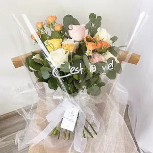 Transparent trapezoidal flower packaging bag with artistic 'C'est la vie' print