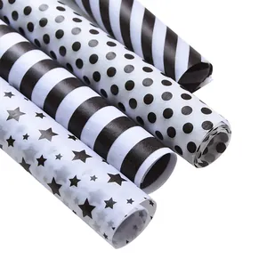Set di 4 rotoli di carta velina a motivi bianchi e neri per confezioni regalo e fiori