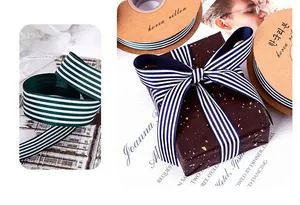 Detail view showing elegant vertical striped grosgrain ribbon used for gift box wrapping